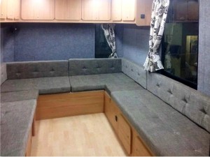 This seating area converts into a 5 berth sleeping area at night, with slide out beds - van conversion by Céide Campervan Conversions, Co. Donegal,  Ireland