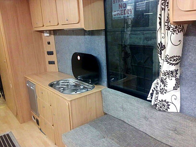 Overview of kitchen area with campervan seating fitted by Céide Campervan Conversions, Co. Donegal, North-West Ireland